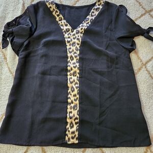 Black top with animal print.